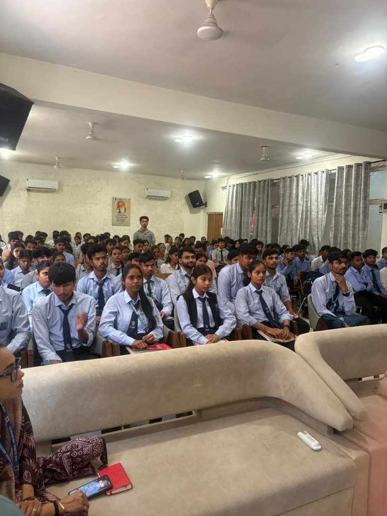 Students attending a SoftIQ seminar in a packed hall